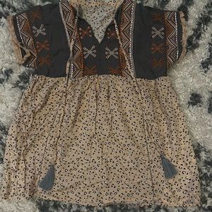 Leopard print top with Aztec design stitching and ties with tassels